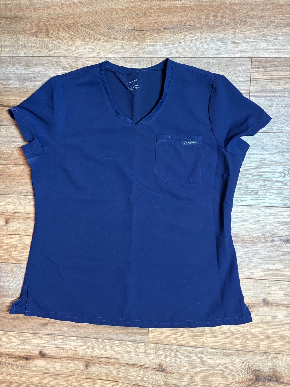 Jaanuu Women's Helia V-Neck Scrub Top in the color Midnight Navy - Picture 2 of 7